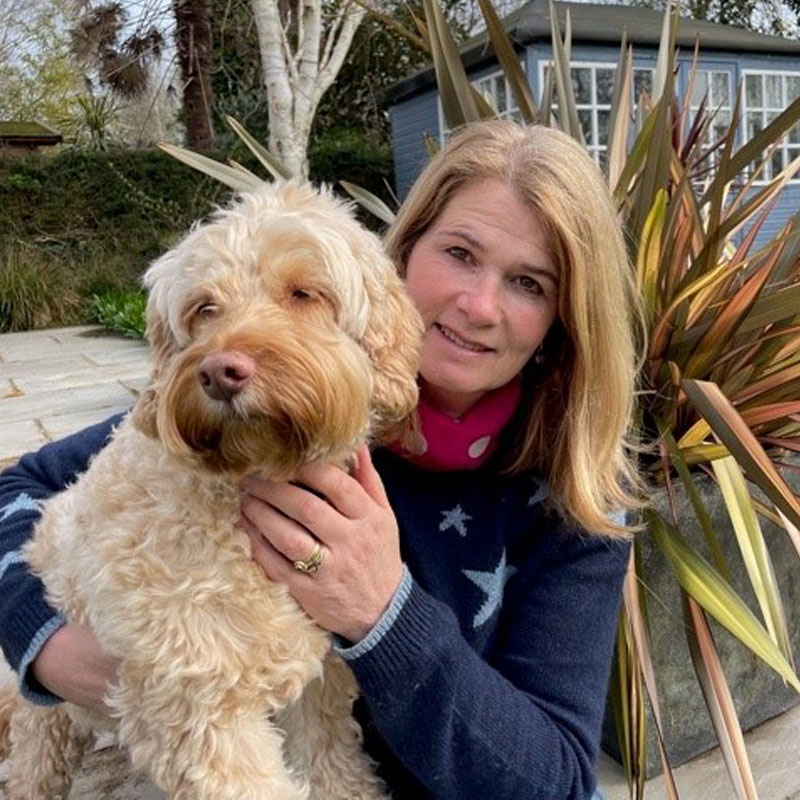 Photo of Judi Tipping holding her dog          