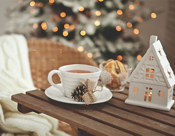 Close up of a table with a Christmas tree in the background