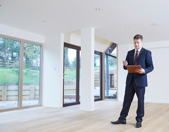Image showing a close up of a estate agent looking around property